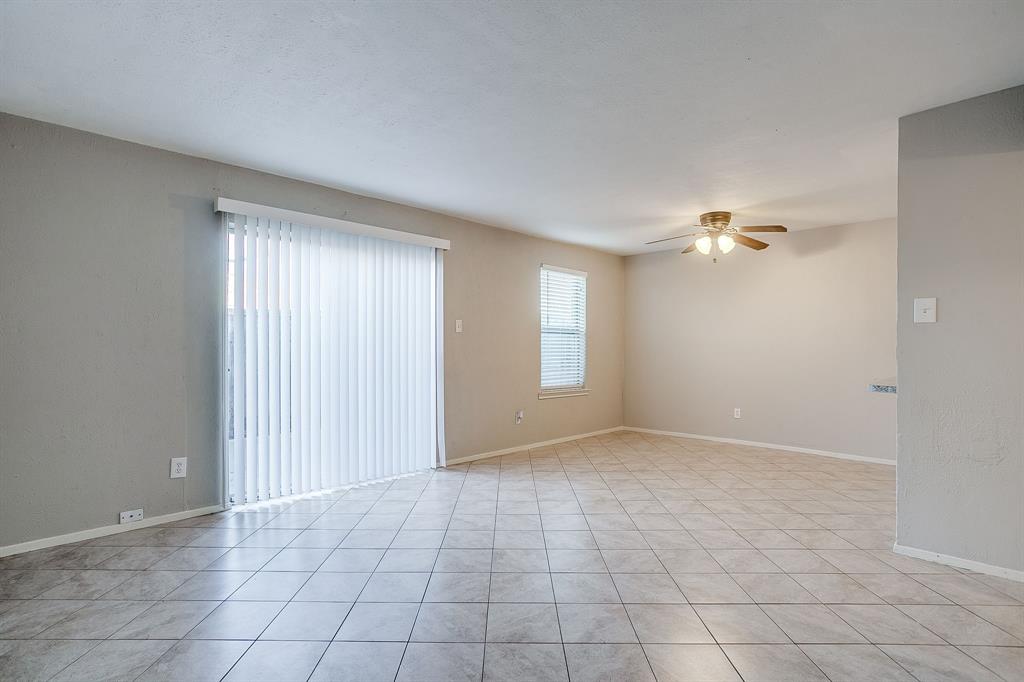 3400 Sanguinet Street, Unit RIGHT Fort Worth, TX 76107 - Photo 11 of 22 a view of an empty room with window and chandelier fan
