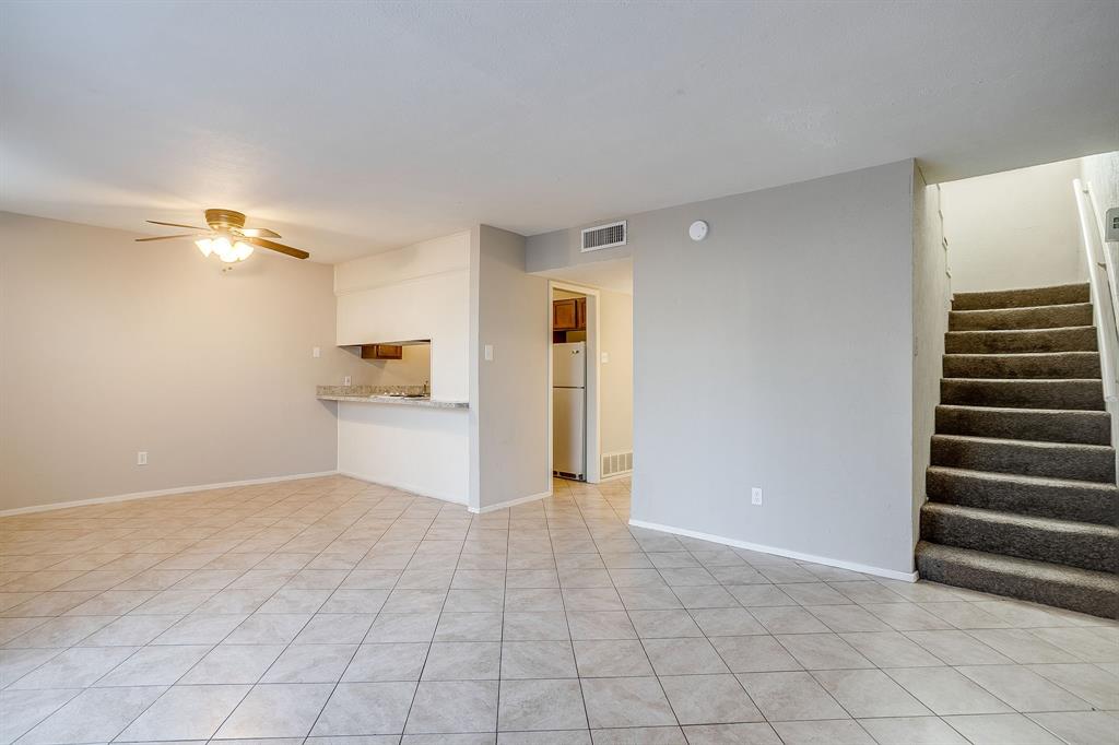 3400 Sanguinet Street, Unit RIGHT Fort Worth, TX 76107 - Photo 12 of 22 a view of a kitchen with wooden floor and electronic appliances