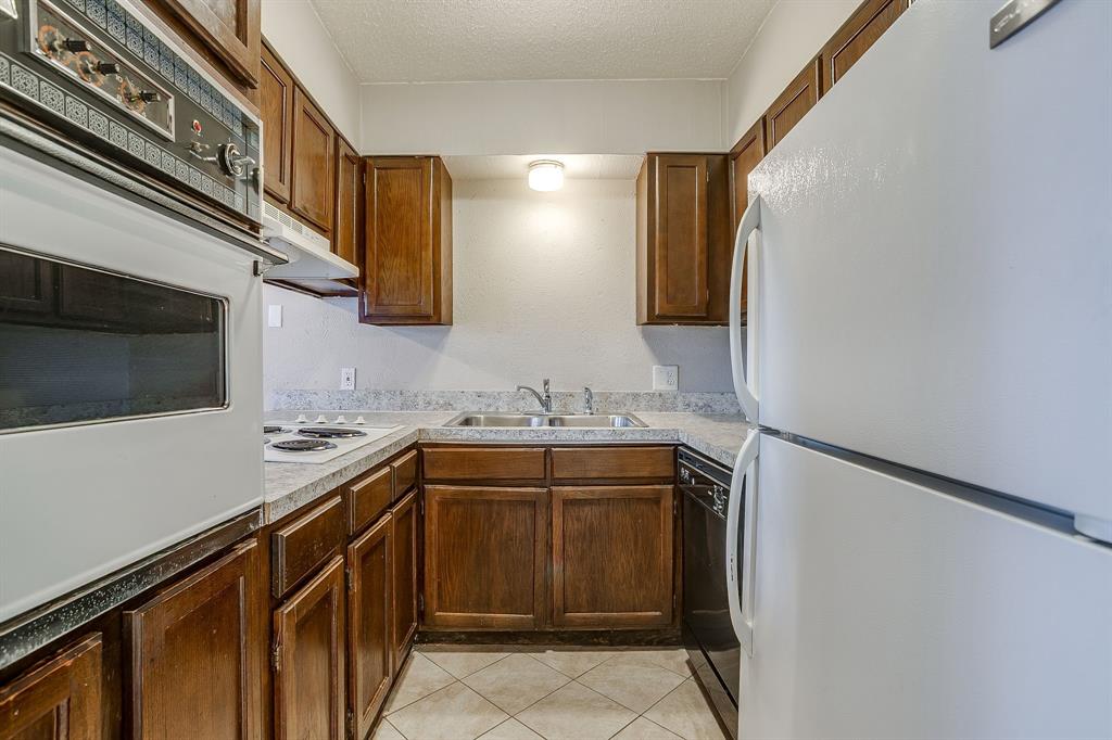 3400 Sanguinet Street, Unit RIGHT Fort Worth, TX 76107 - Photo 5 of 22 a view of a sink and dishwasher in a kitchen