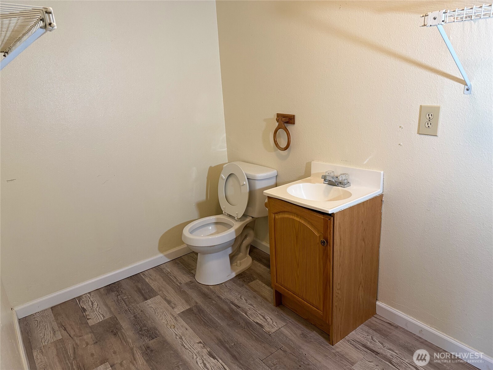 20925 260th Avenue Southeast Maple Valley, WA 98038 - Photo 13 of 34 a white toilet sitting next to a bathroom sink