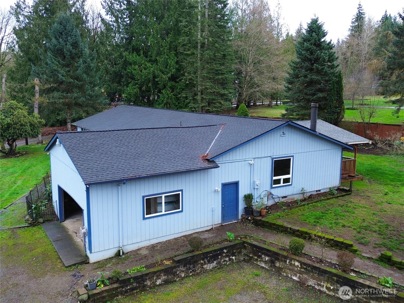 20925 260th Avenue Southeast Maple Valley, WA 98038 - Photo 17 of 34 a house with trees in the background