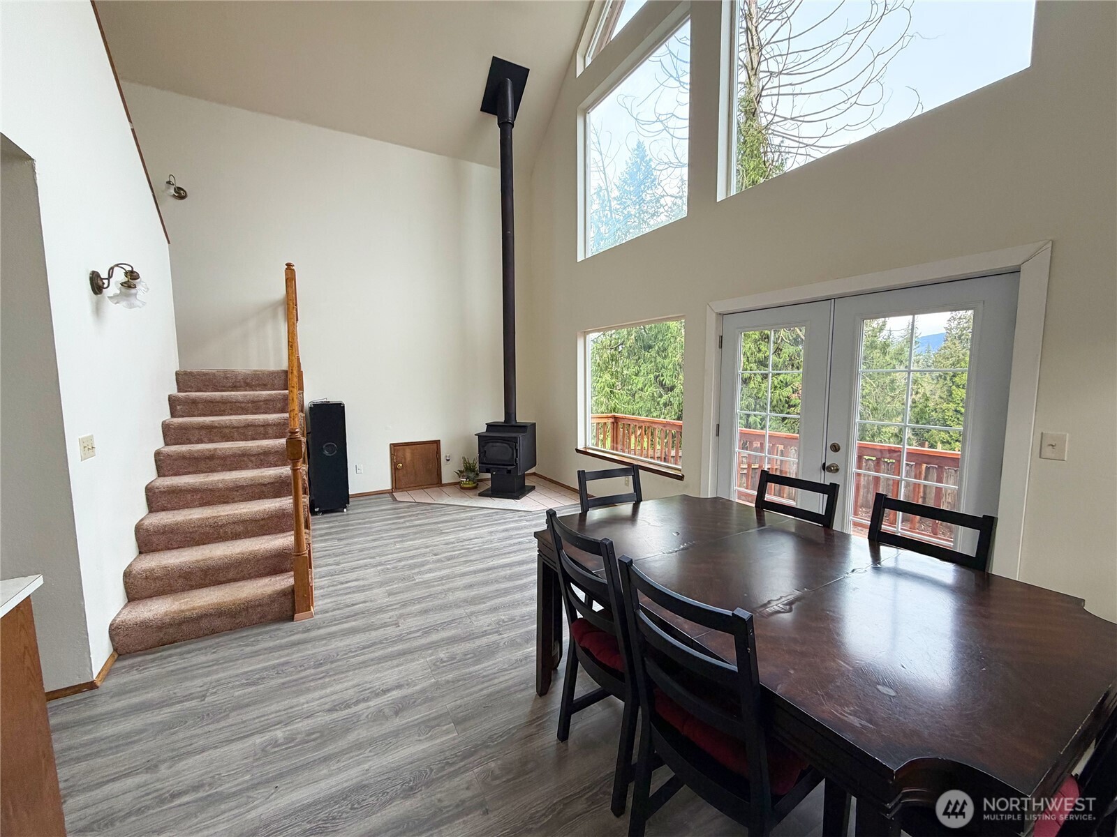 20925 260th Avenue Southeast Maple Valley, WA 98038 - Photo 24 of 34 a view of a dining room with furniture and wooden floor
