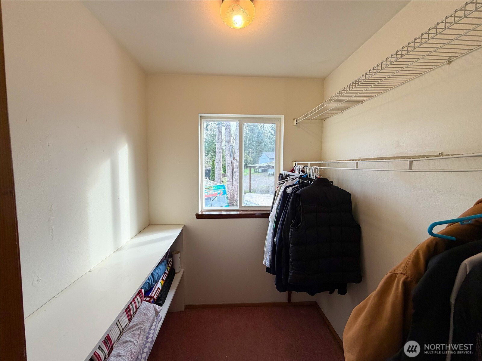 20925 260th Avenue Southeast Maple Valley, WA 98038 - Photo 30 of 34 a bed room with a bed and a window