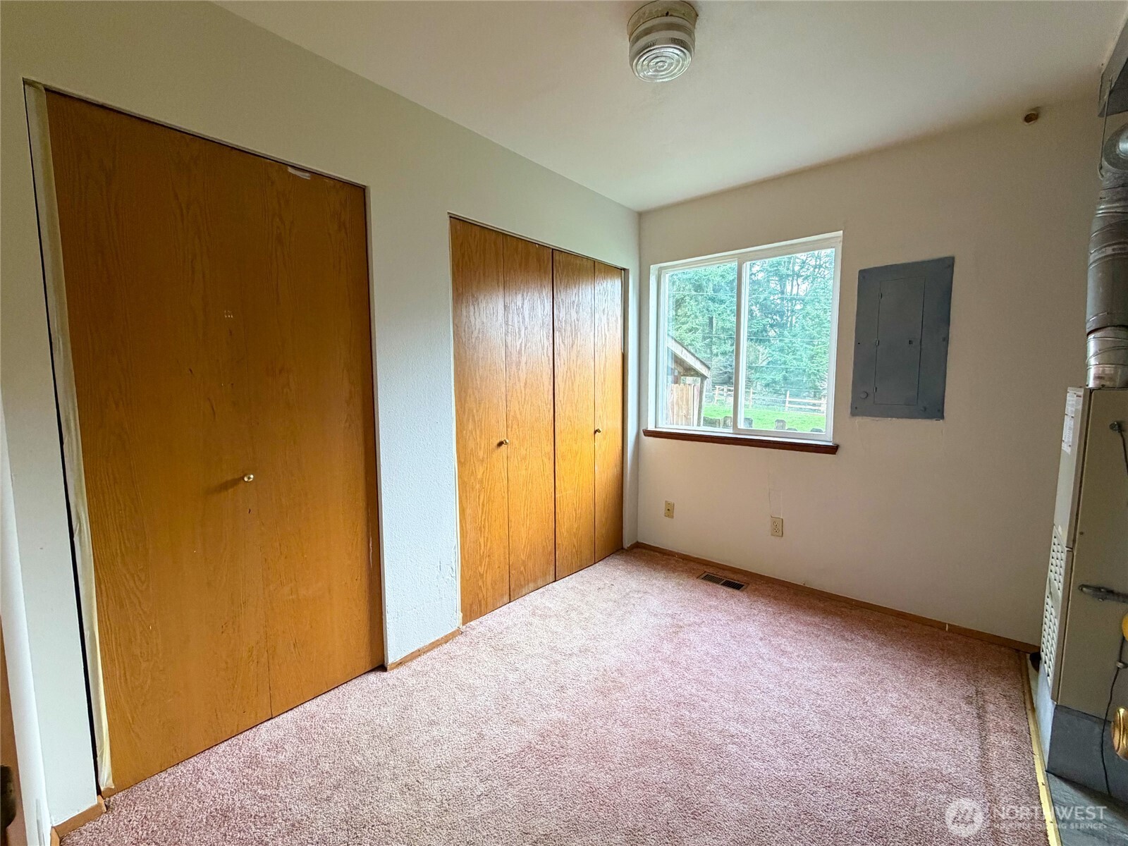 20925 260th Avenue Southeast Maple Valley, WA 98038 - Photo 32 of 34 a view of an empty room with a window