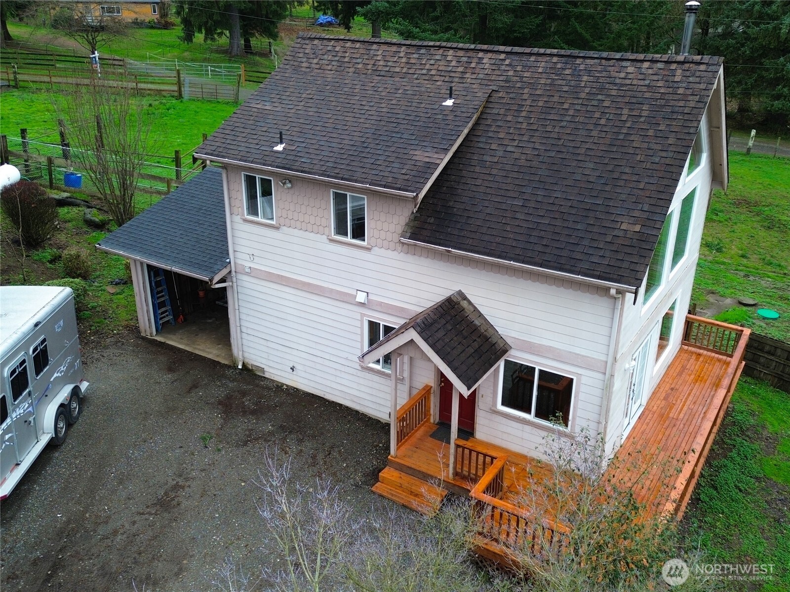 20925 260th Avenue Southeast Maple Valley, WA 98038 - Photo 34 of 34 a aerial view of a house with a yard and deck