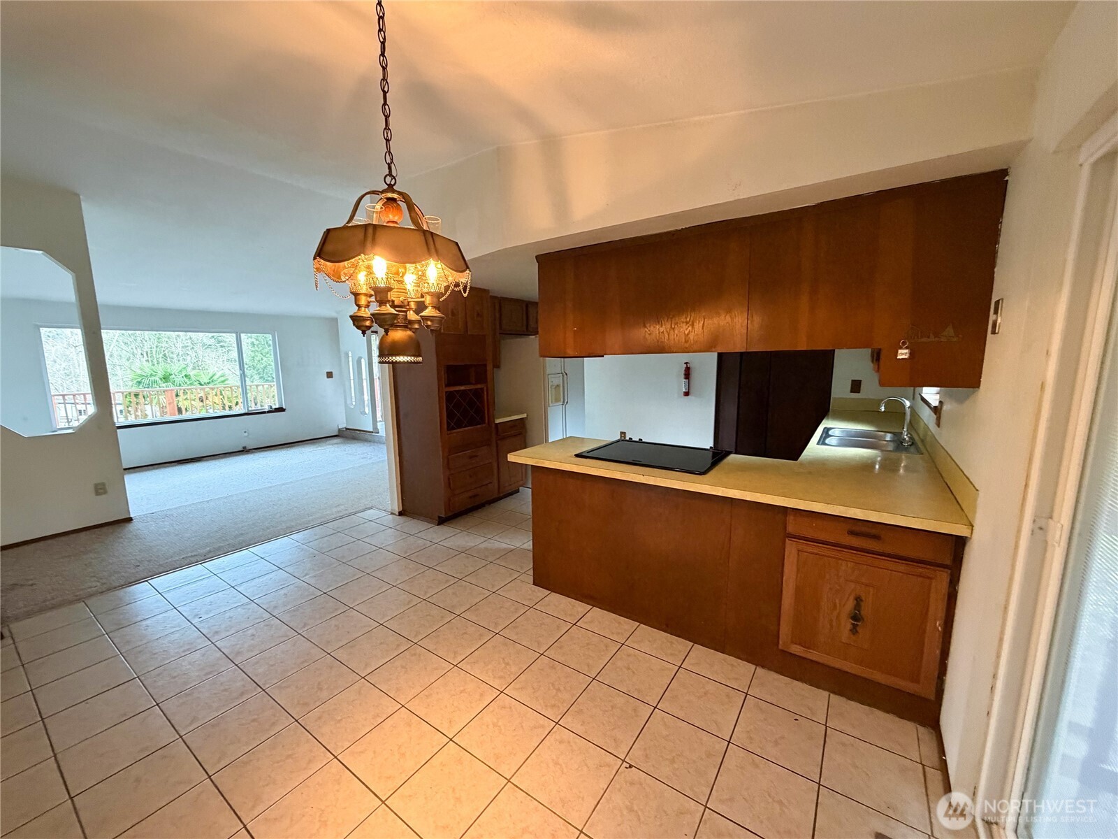 20925 260th Avenue Southeast Maple Valley, WA 98038 - Photo 6 of 34 a kitchen with stainless steel appliances granite countertop a refrigerator a stove and a sink