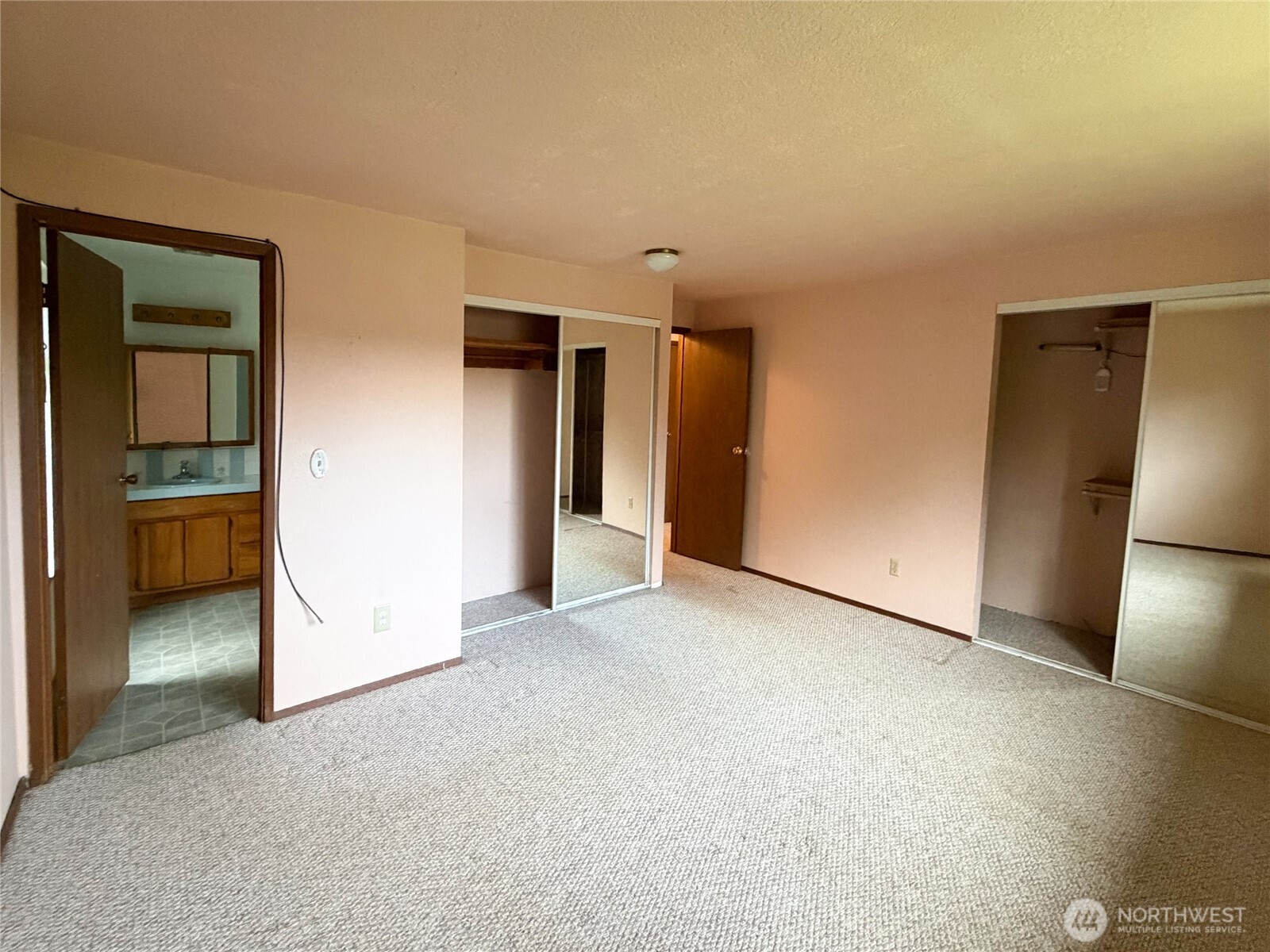 20925 260th Avenue Southeast Maple Valley, WA 98038 - Photo 10 of 34 an empty room with closet and mirrors