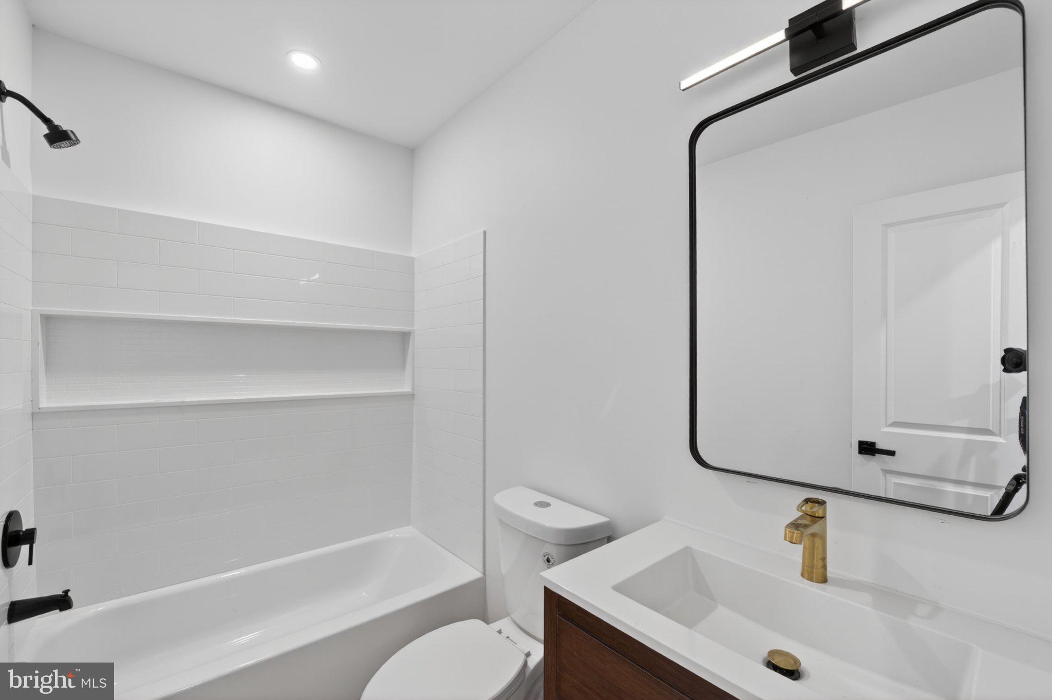 412 Newcomb Street Southeast Washington, DC 20032 - Photo 16 of 34 a bathroom with a sink and a mirror