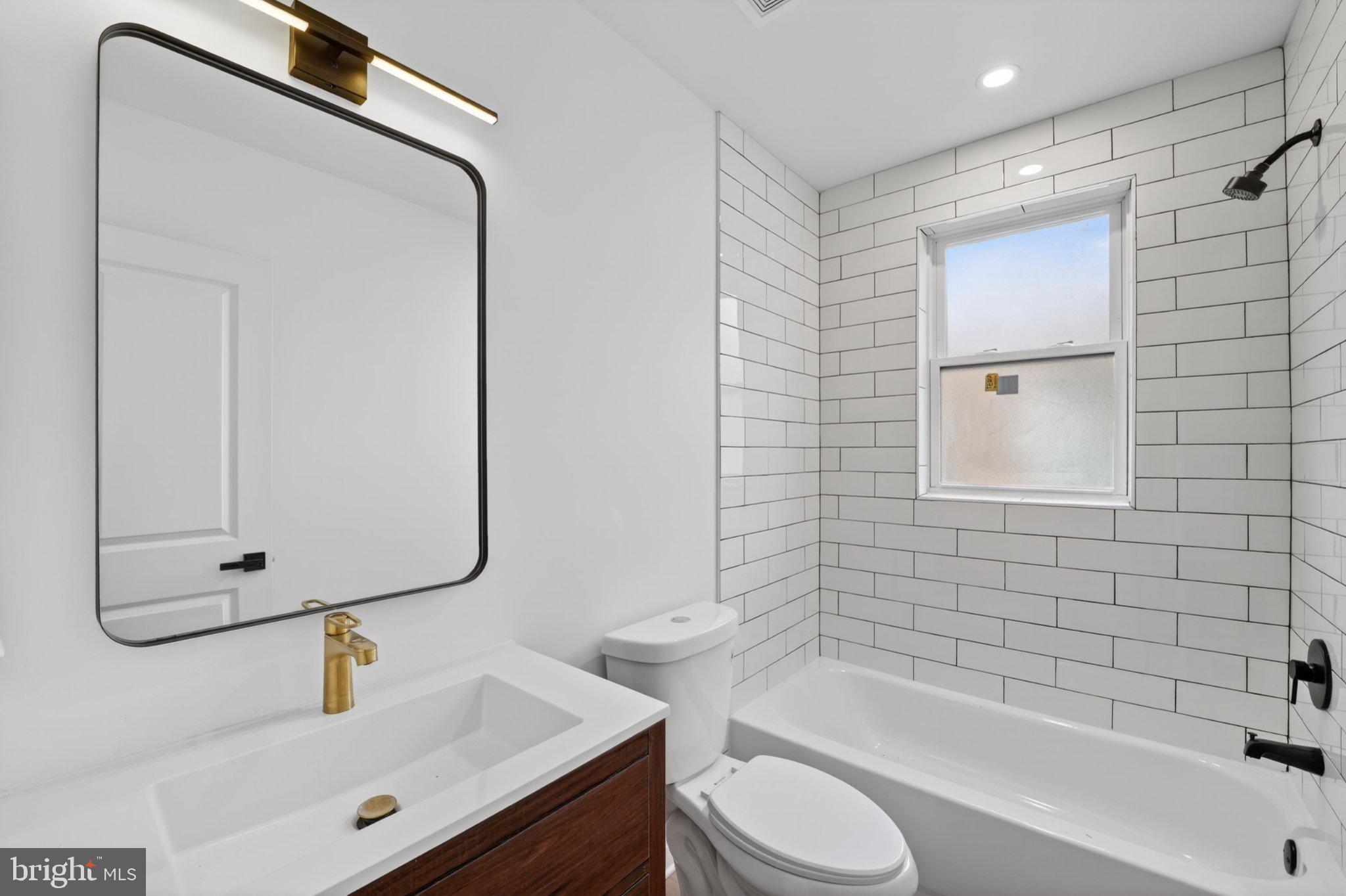 412 Newcomb Street Southeast Washington, DC 20032 - Photo 23 of 34 a bathroom with a sink and a mirror