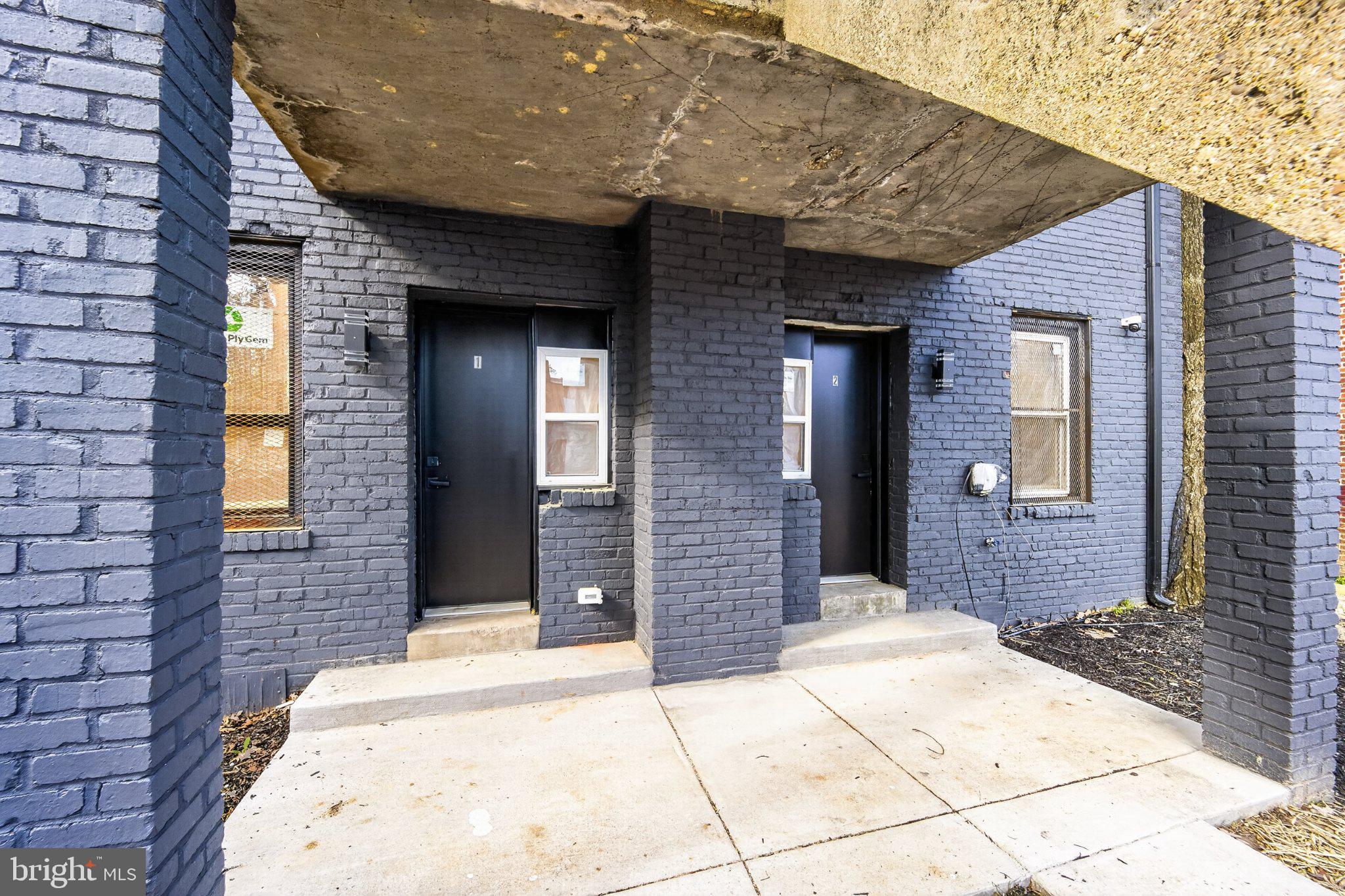 412 Newcomb Street Southeast Washington, DC 20032 - Photo 33 of 34 a view of a brick house with a large door
