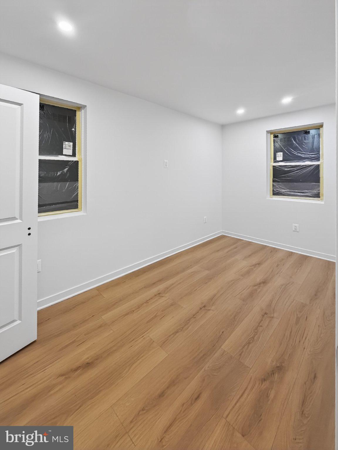 412 Newcomb Street Southeast Washington, DC 20032 - Photo 7 of 34 a view of empty room with wooden floor