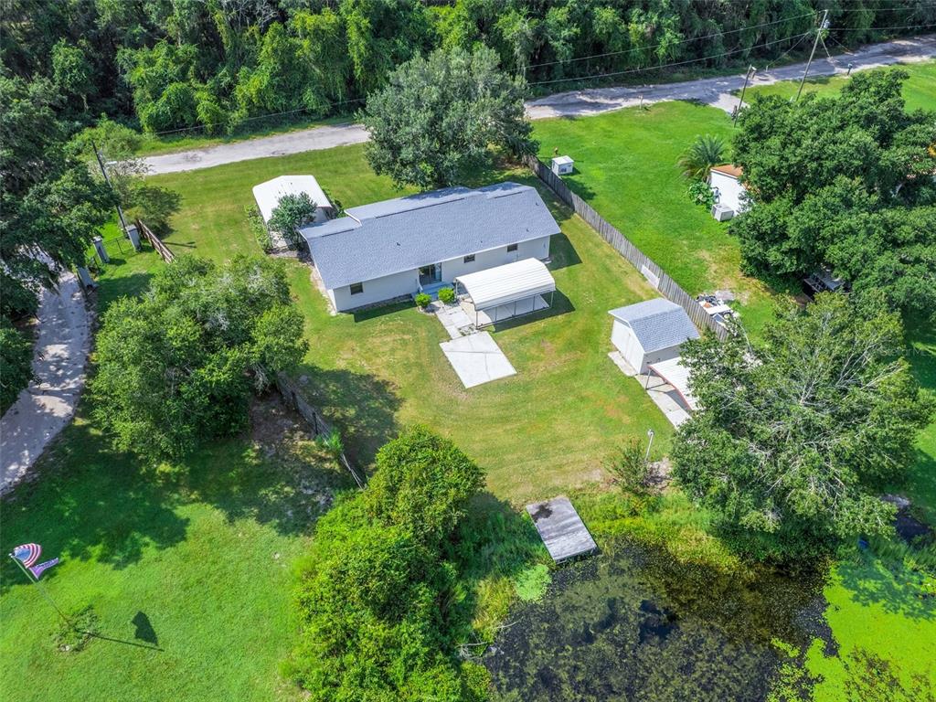 11495 Southeast 121st Lane Road Belleview, FL 34420 - Photo 29 of 31 an aerial view of residential houses with outdoor space and trees all around