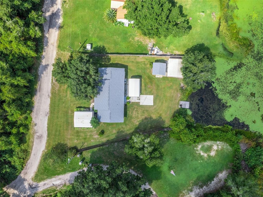 11495 Southeast 121st Lane Road Belleview, FL 34420 - Photo 30 of 31 an aerial view of a house with a yard