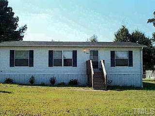 1324 Chamblee Road Zebulon, NC 27597 - Photo 1 of 1 a view of house with backyard
