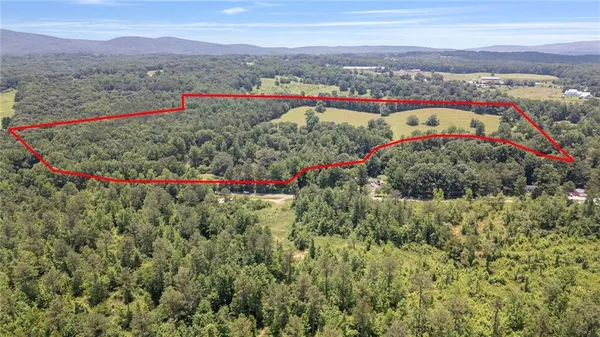 a view of an outdoor space with a mountain