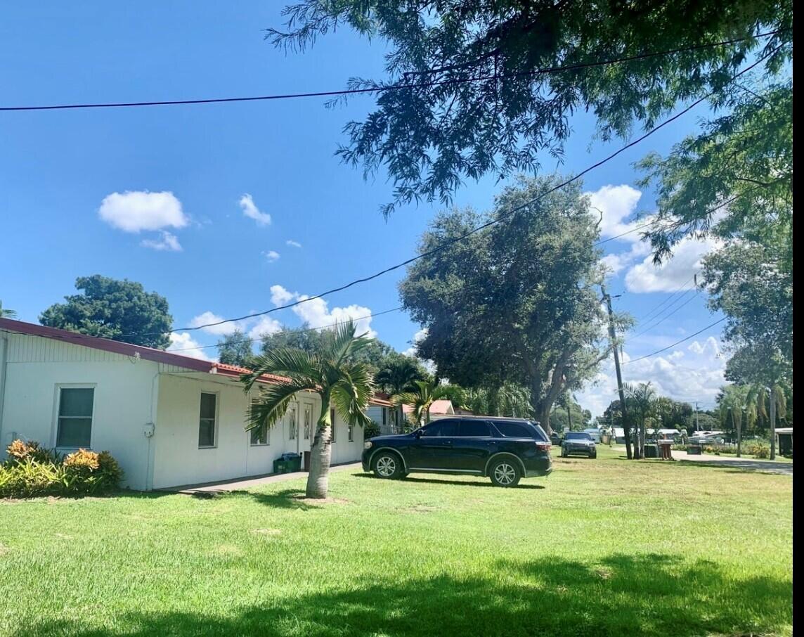 3203 Southeast 29th Lane, Unit 4 Okeechobee, FL 34974 - Photo 4 of 14 a view of a house with a swimming pool