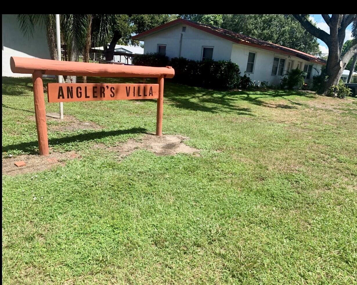 3203 Southeast 29th Lane, Unit 4 Okeechobee, FL 34974 - Photo 5 of 14 a sign that is sitting in front of a house