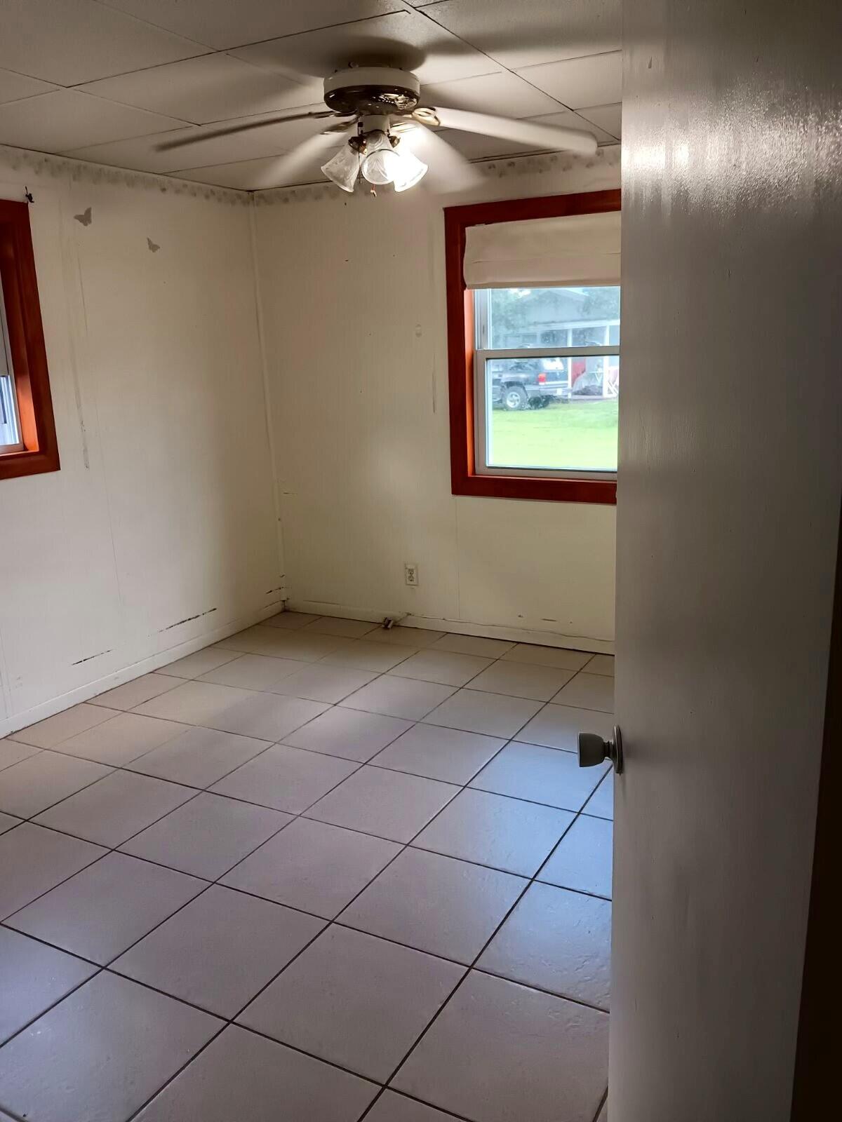 3203 Southeast 29th Lane, Unit 4 Okeechobee, FL 34974 - Photo 8 of 14 a view of an empty room