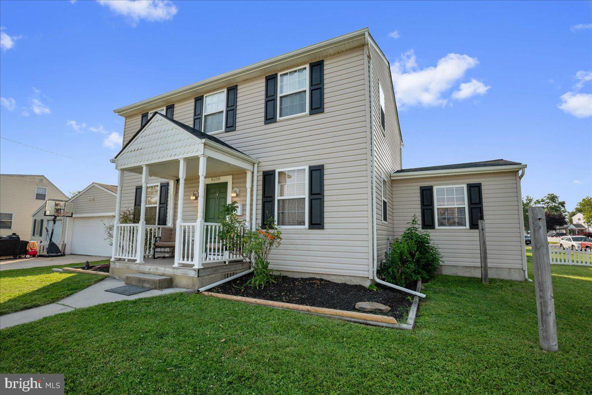 8255 Longpoint Road Baltimore, MD 21222 - Photo 15 of 54 a front view of a house with a yard