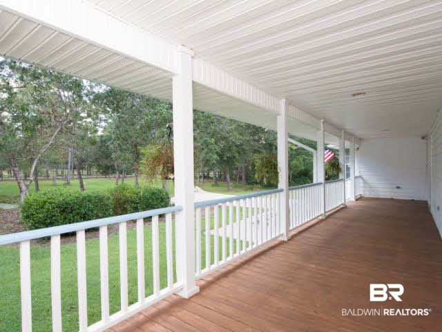 18700 East River Road South Silverhill, AL 36576 - Photo 9 of 32 Large front porch for enjoying the summer breeze.
