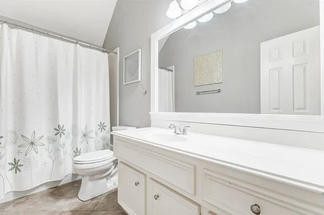 a bathroom with a bathtub and a sink