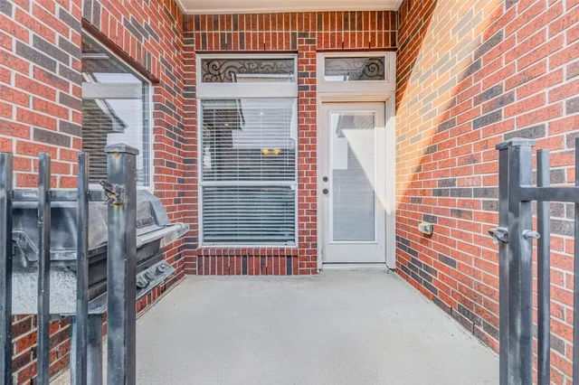a view of a chair and table in the back yard