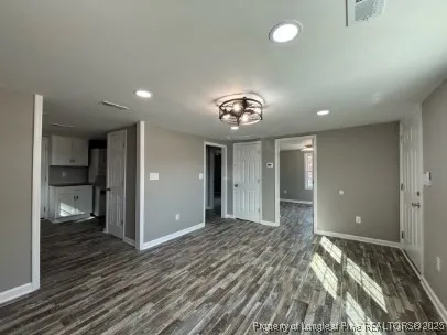 wooden floor in an empty room with a workspace