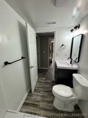 a bathroom with a toilet and a sink