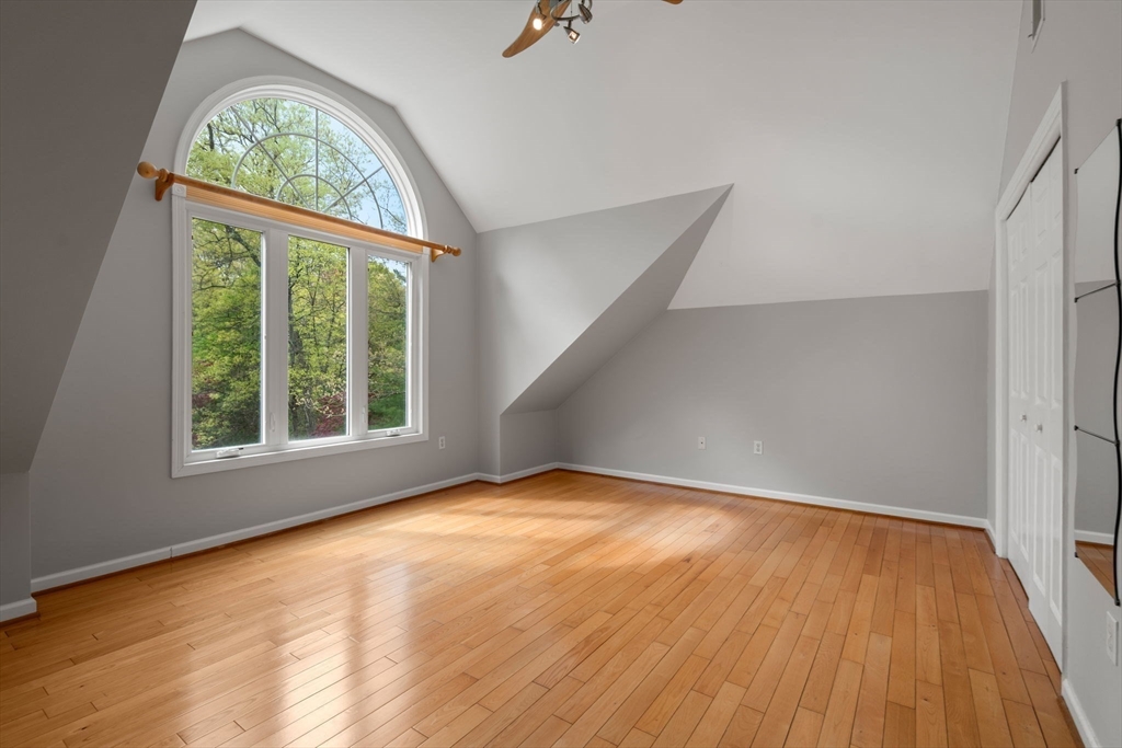 11 Black Elk Road Sharon, MA 02067 - Photo 17 of 28 an empty room with wooden floor cabinet and windows