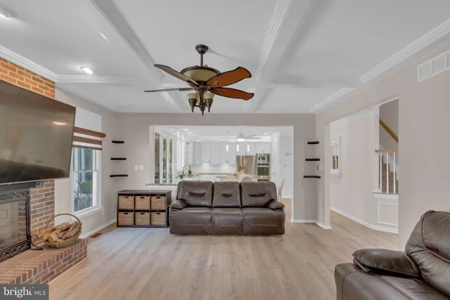 a view of a room with wooden floor and a window