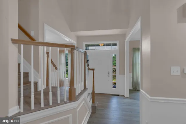 a bedroom with a large bed and a flat screen tv