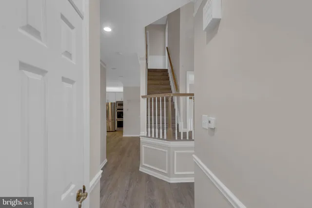 a spacious bedroom with a bed and a window