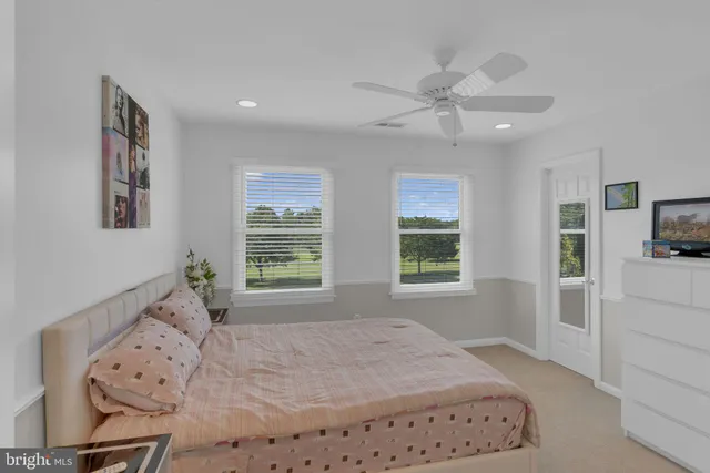a outdoor living space with furniture potted plant and a large window
