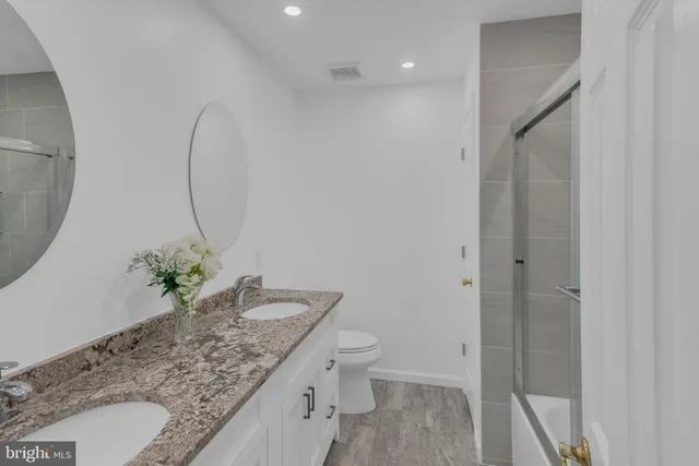 a view of an outdoor sitting area with a tub and couches