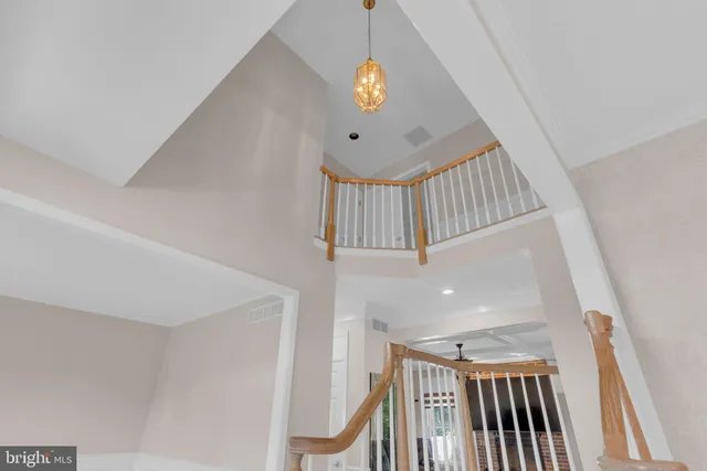 a kitchen with refrigerator a stove and furniture