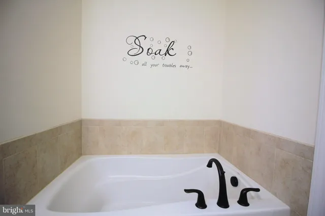 a bathroom with a bathtub