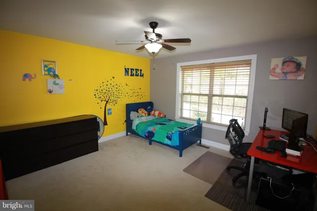 a bed room with furniture and a window