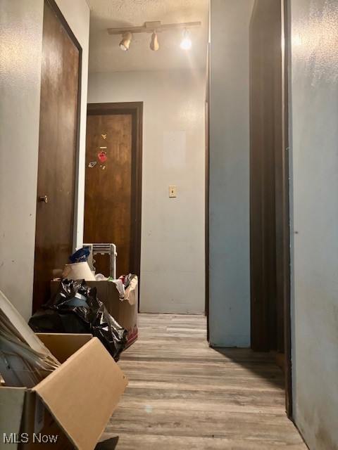 3077 Anderson Anthony Road Northwest Warren, OH 44481 - Photo 12 of 31 Hallway with light wood-style floors and a textured ceiling