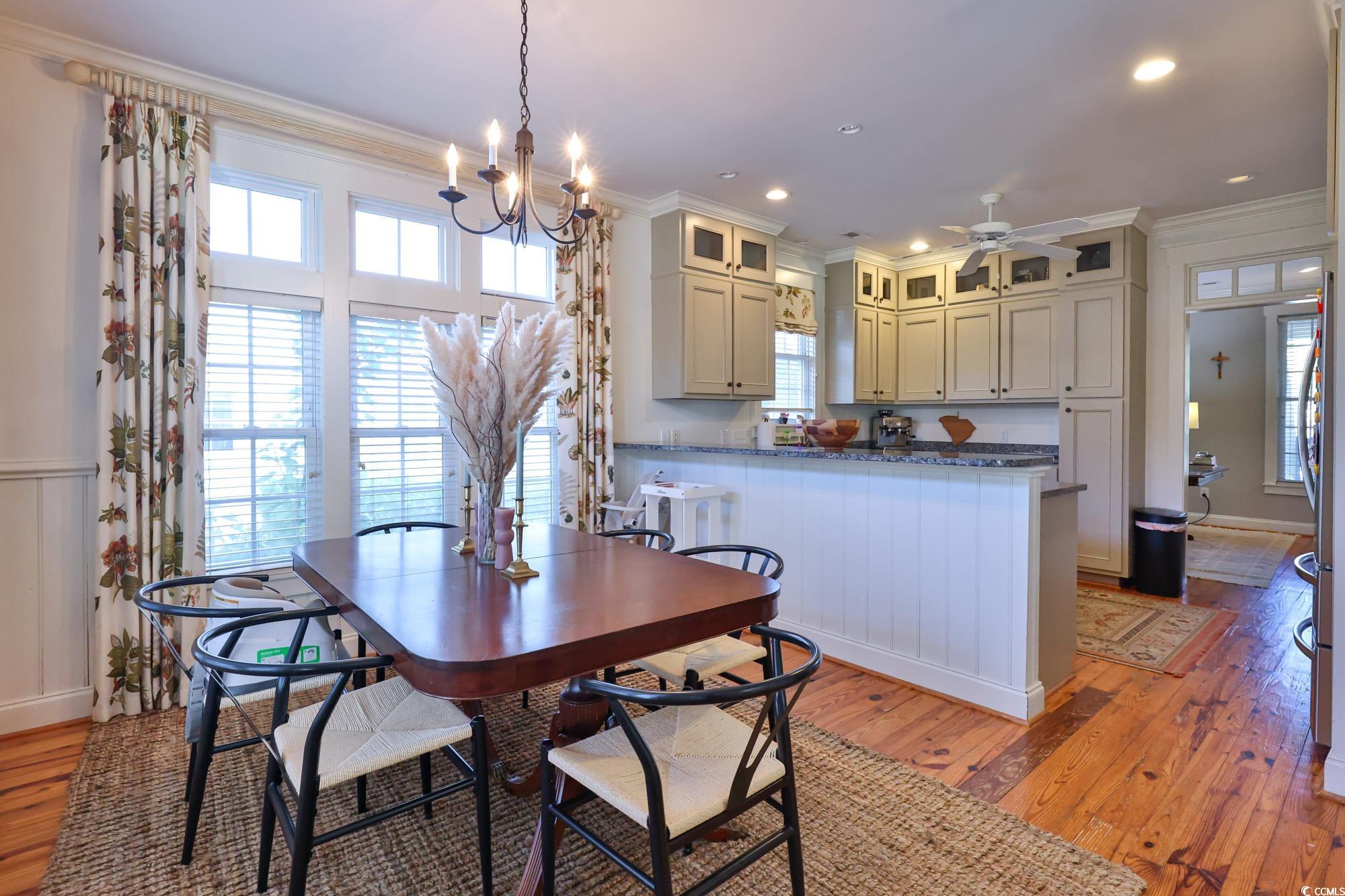 998 Shipmaster Avenue Myrtle Beach, SC 29579 - Photo 17 of 40 Dining area featuring ornamental molding, light wood-type flooring, recessed lighting, and a chandelier