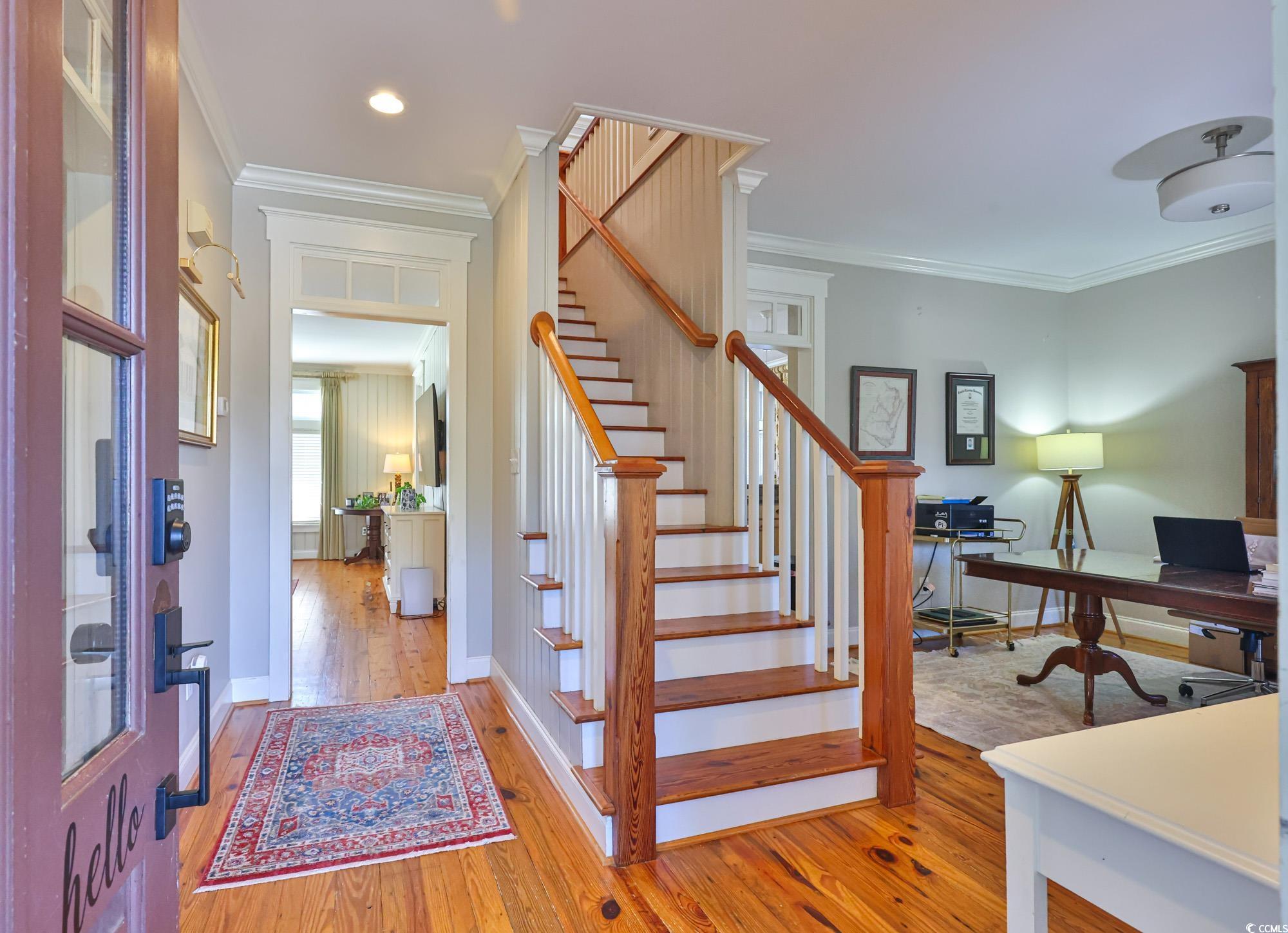 998 Shipmaster Avenue Myrtle Beach, SC 29579 - Photo 22 of 40 Stairway with ornamental molding and wood-type flooring