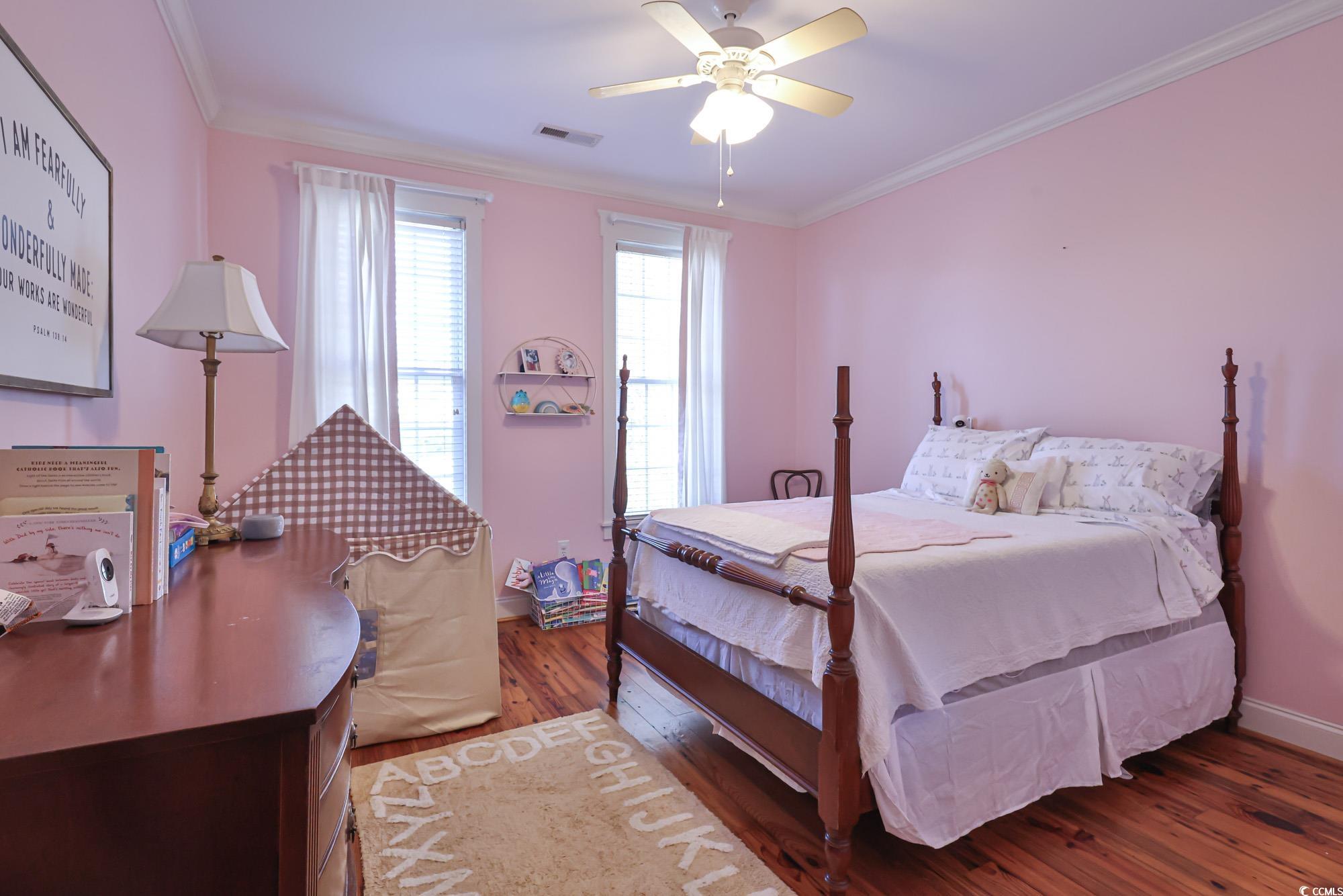 998 Shipmaster Avenue Myrtle Beach, SC 29579 - Photo 29 of 40 Bedroom featuring crown molding, dark wood-style floors, and ceiling fan