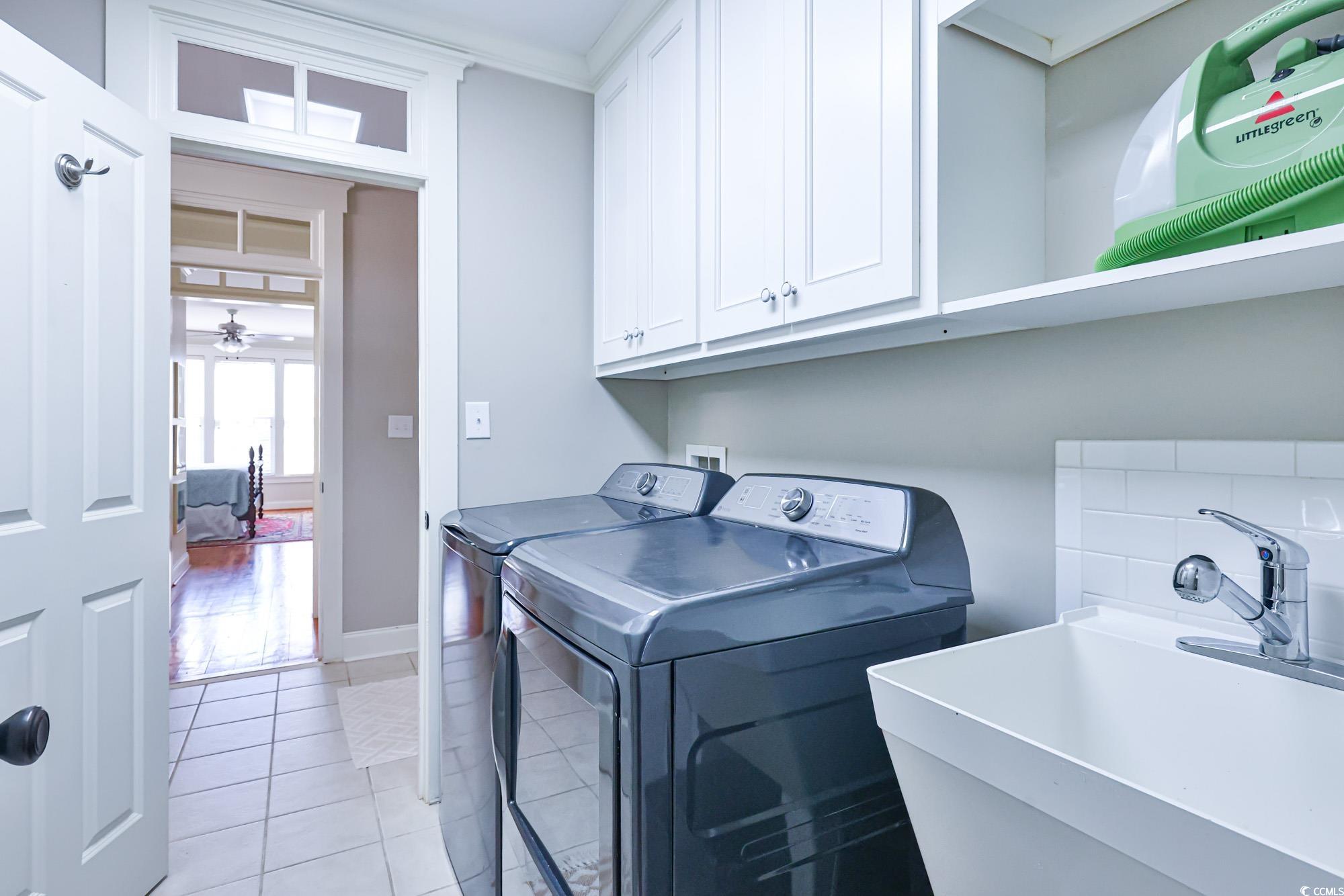 998 Shipmaster Avenue Myrtle Beach, SC 29579 - Photo 33 of 40 Washroom with light tile patterned floors, cabinet space, ceiling fan, and washer and clothes dryer