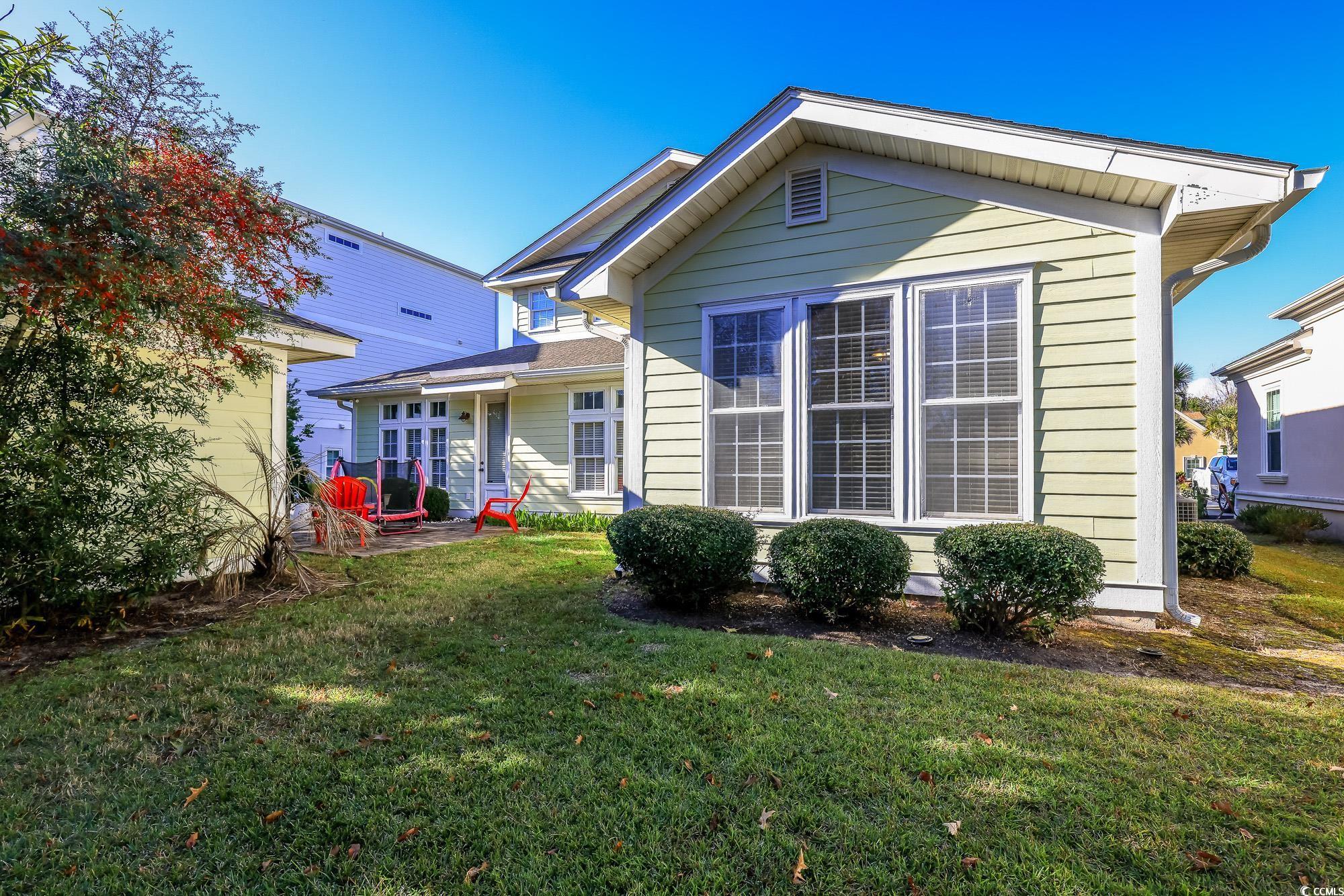 998 Shipmaster Avenue Myrtle Beach, SC 29579 - Photo 34 of 40 Rear view of house featuring a yard and a patio