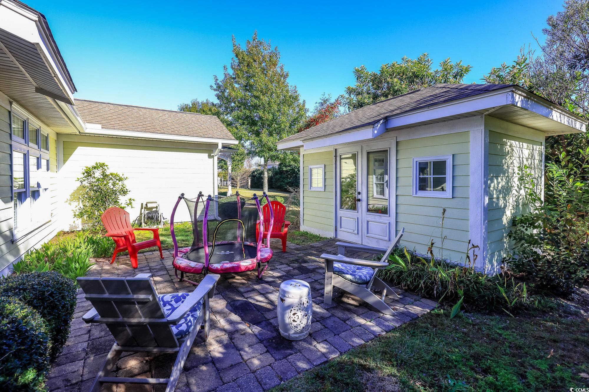 998 Shipmaster Avenue Myrtle Beach, SC 29579 - Photo 36 of 40 View of patio / terrace featuring a fire pit and an outdoor structure
