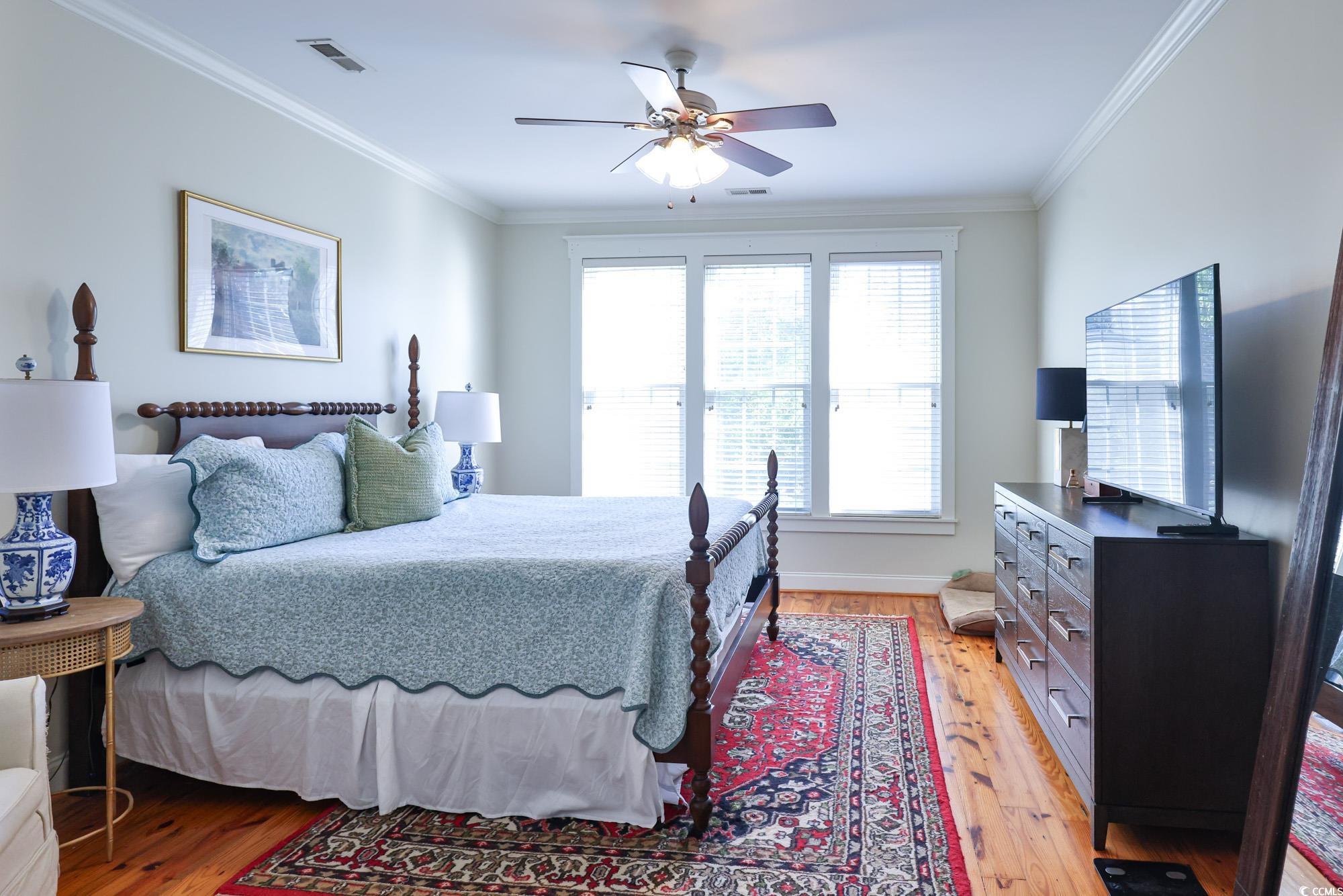 998 Shipmaster Avenue Myrtle Beach, SC 29579 - Photo 7 of 40 Bedroom featuring light wood-type flooring, crown molding, and a ceiling fan