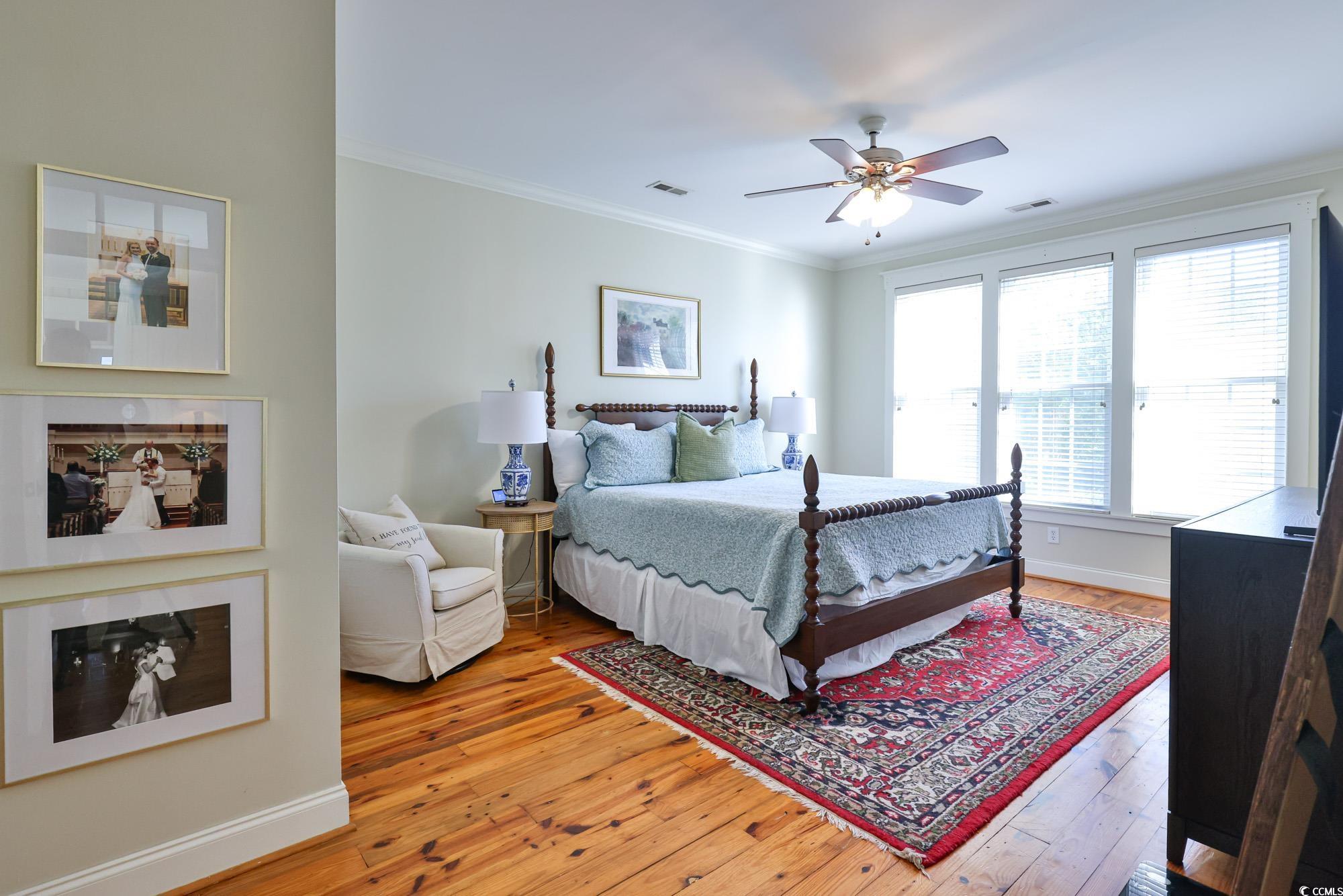 998 Shipmaster Avenue Myrtle Beach, SC 29579 - Photo 9 of 40 Bedroom with light wood-style flooring, ornamental molding, and ceiling fan