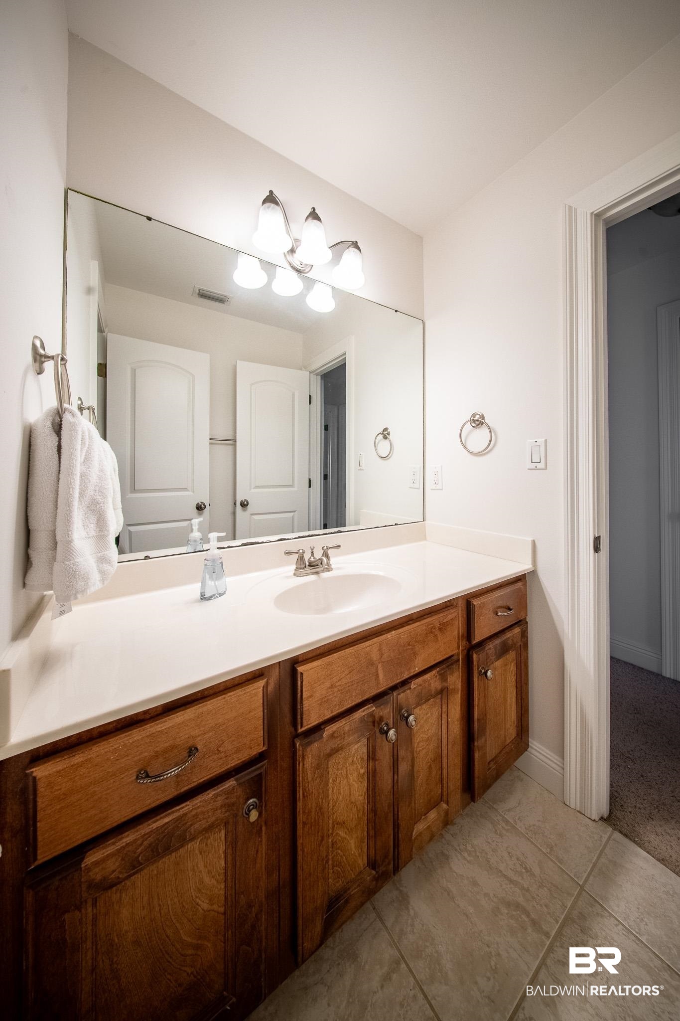 8421 Weatherford Court Daphne, AL 36527 - Photo 26 of 36 Bathroom featuring vanity and tile patterned floors