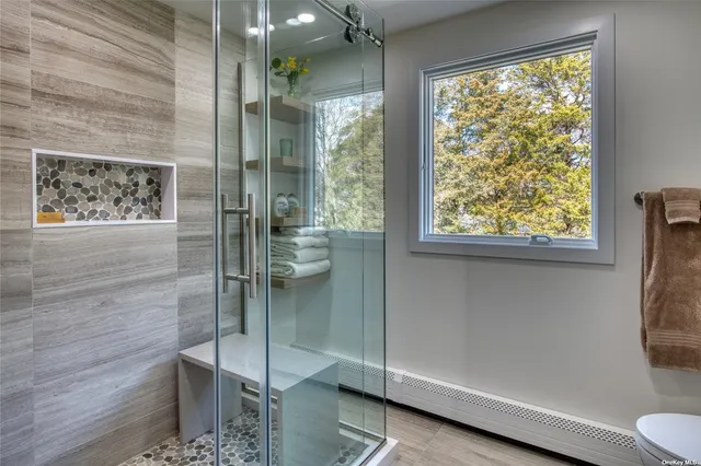 a bathroom with a shower and a toilet