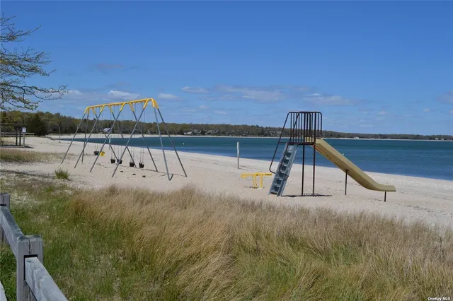 a view of a swimming pool with a lake from a balcony