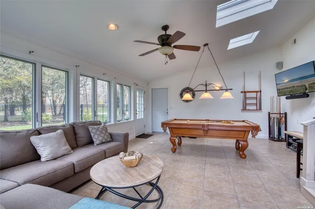 a living room with furniture and a window